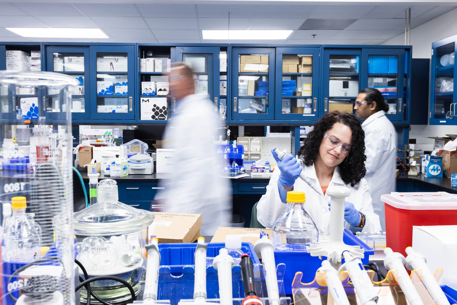 Members of our polymer science team working in our facility